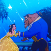 Belle and the Beast holding hands on the balcony in the animated Beauty and the Beast movie by Disney